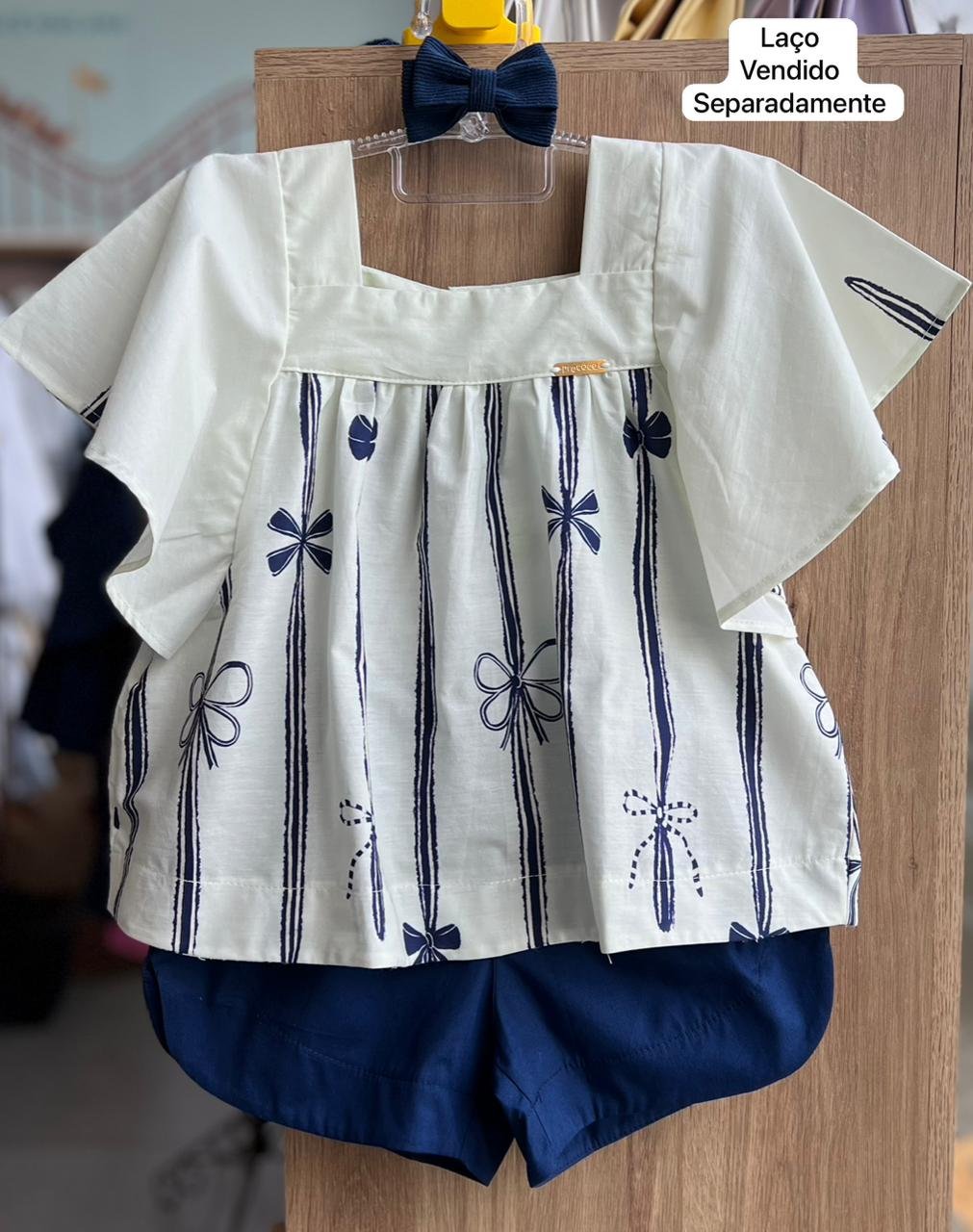 CONJUNTO BLUSA MANGA CURTA BABADO LAÇO E SHORT MENINA PRECOCE - CREME/MARINHO